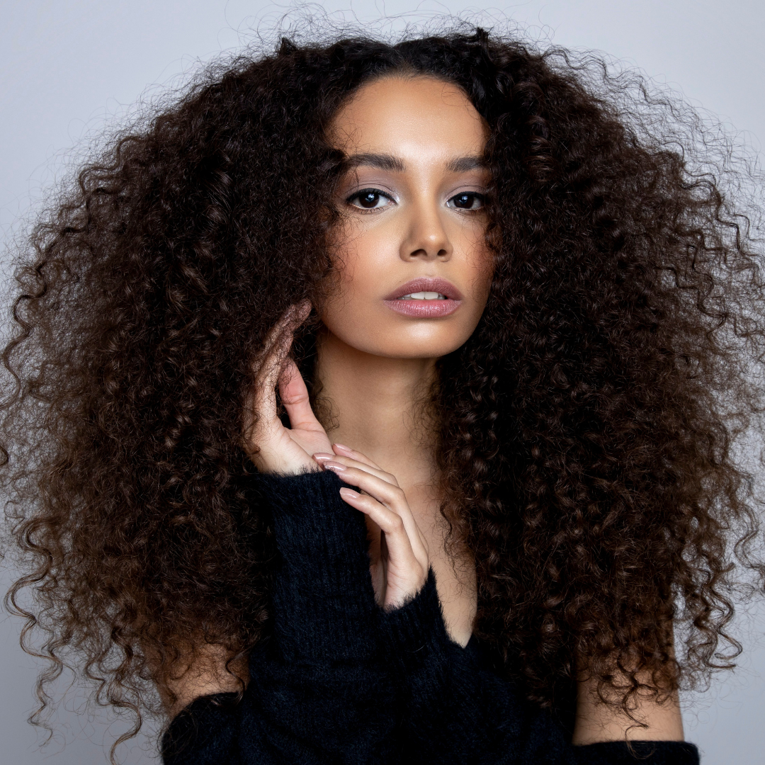 Lady wearing a Kinky Curly Transparent Closure Wig