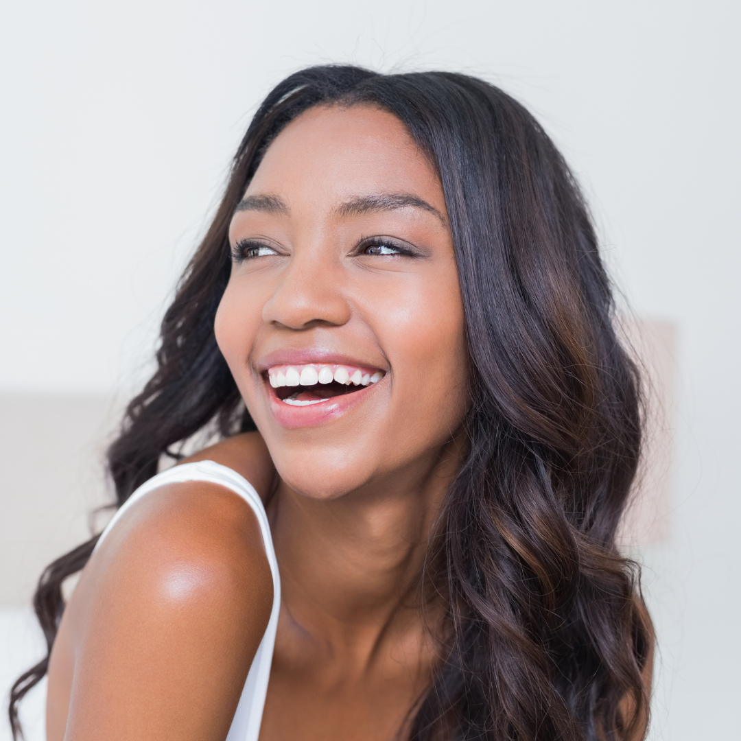 Pretty lady smiling while wearing HD Lace Front Wig
