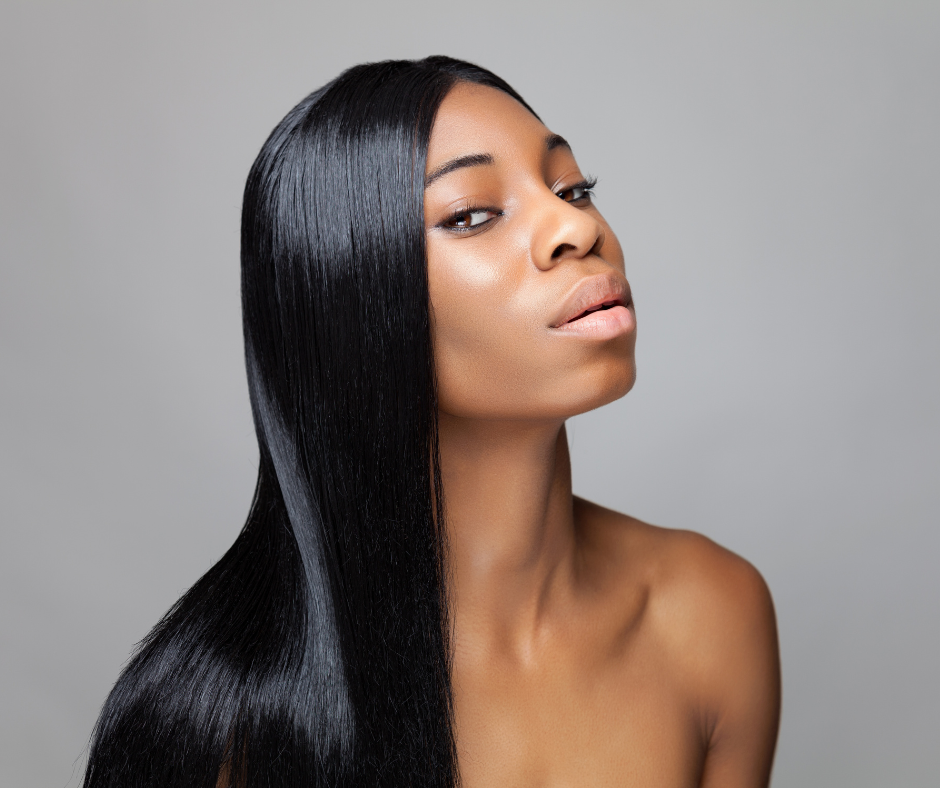 Young woman with looking to the side wearing a long virgin human hair straight hair wig.